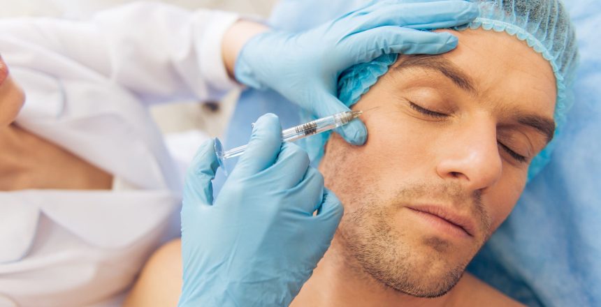 Portrait of man getting an injection in face, lying with closed eyes